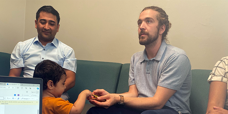 Mason Tuttle with Refugee Family